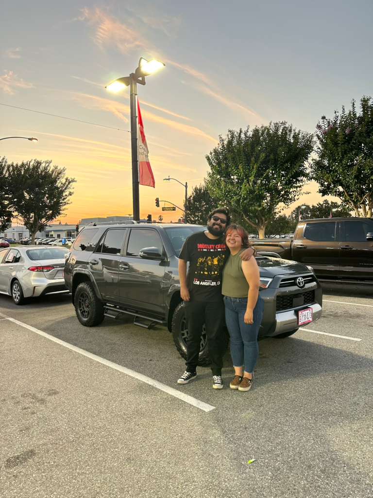 Client vehicle delivery — SUV handoff in the evening