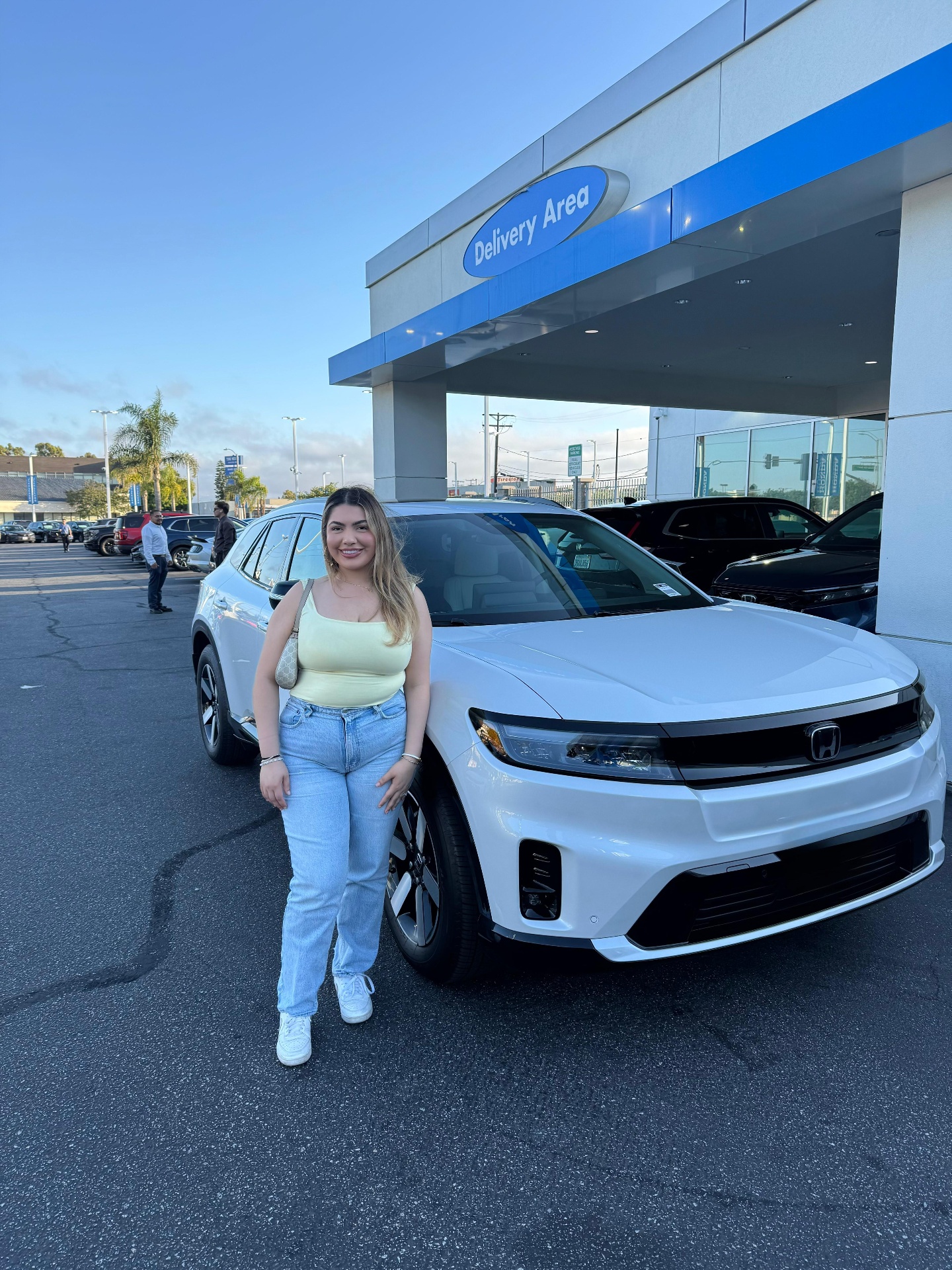 Client vehicle delivery — SUV at dealership delivery area