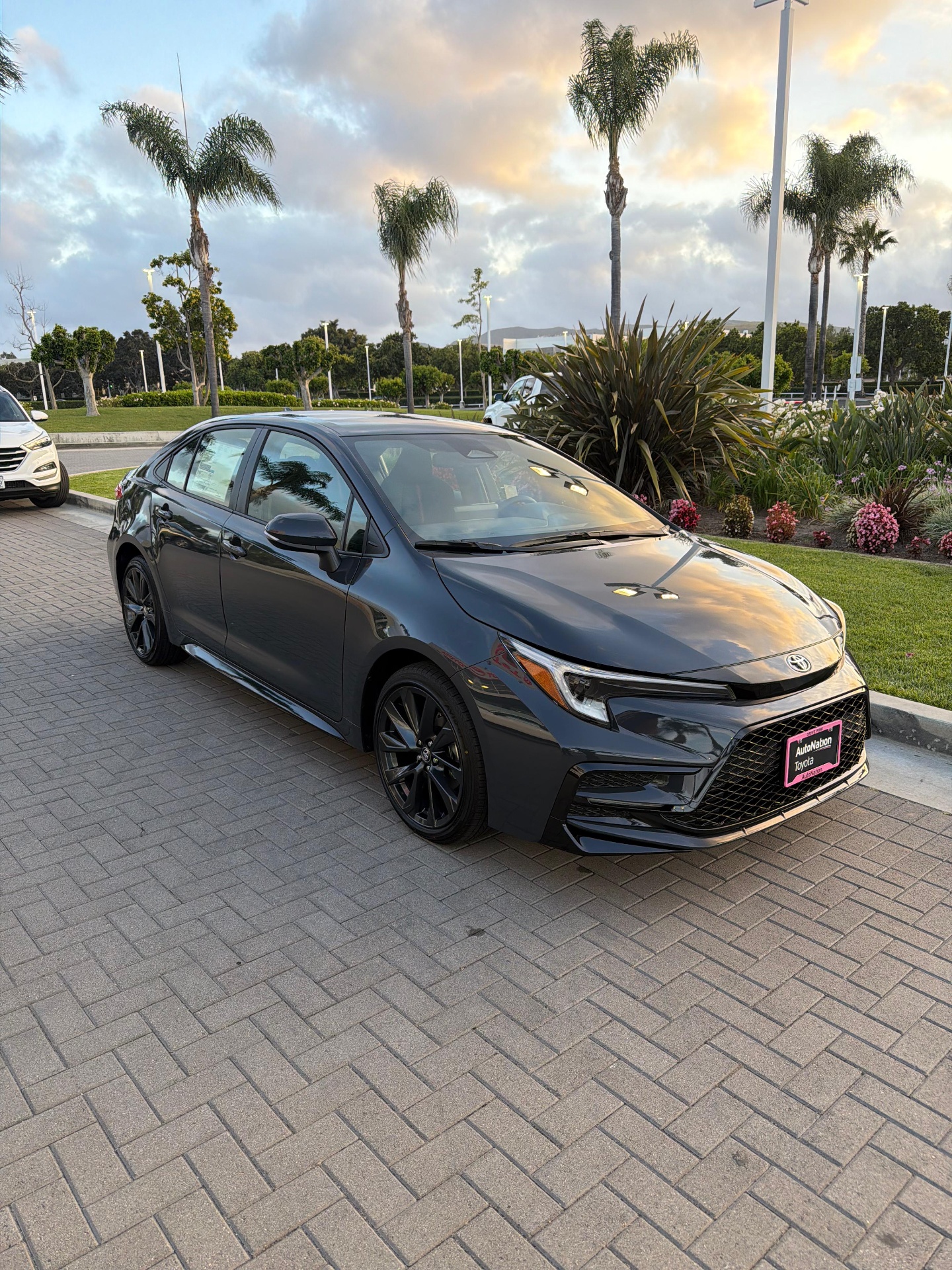Client vehicle delivery — sedan on display at dealership