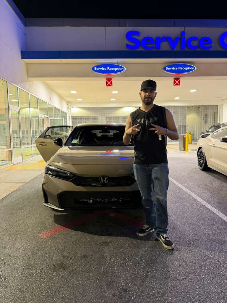 Client vehicle delivery — sedan at service reception